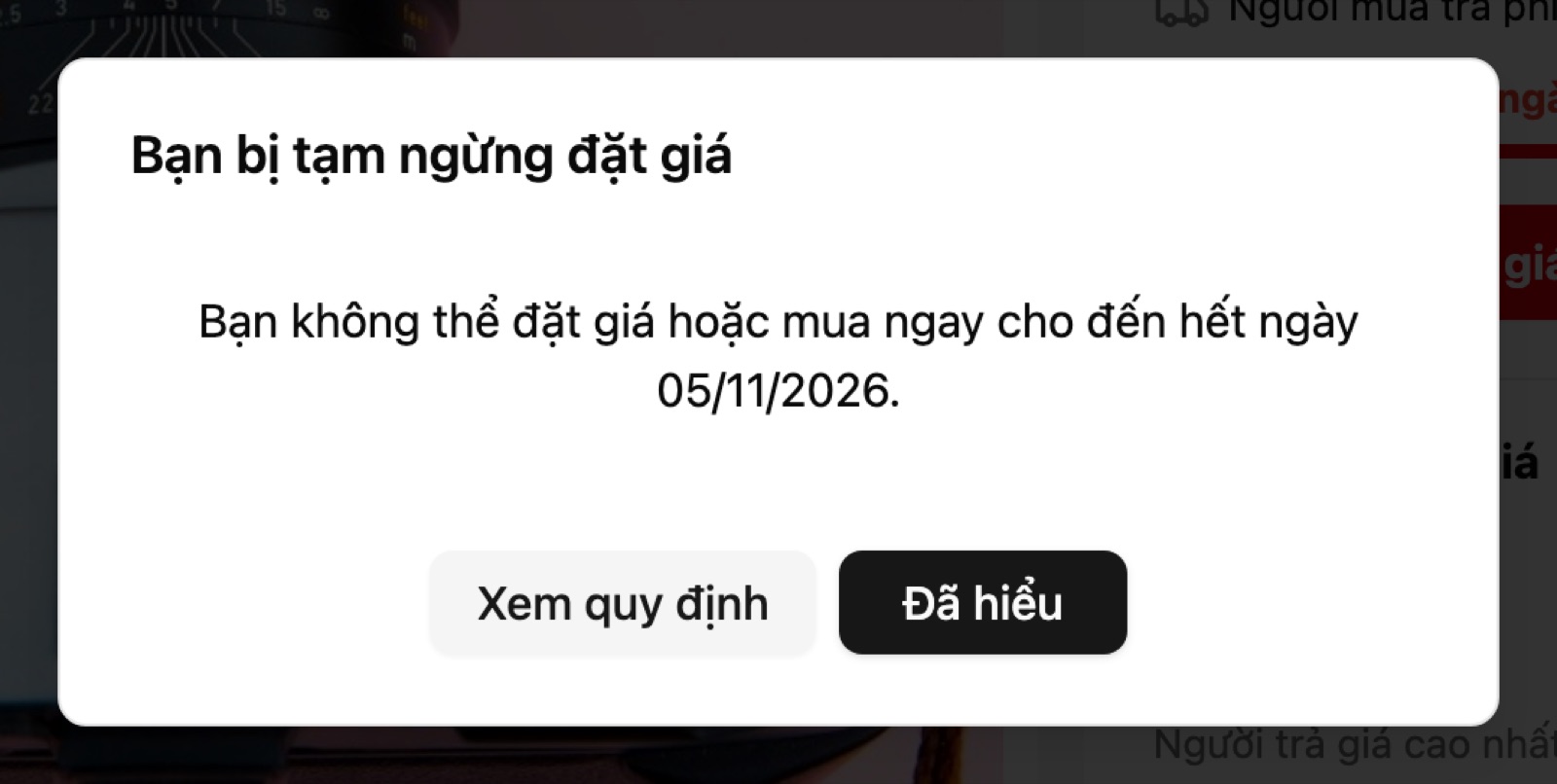 Hộp thông báo Bạn bị tạm ngừng đặt giá, nút Xem quy định và Đã hiểu